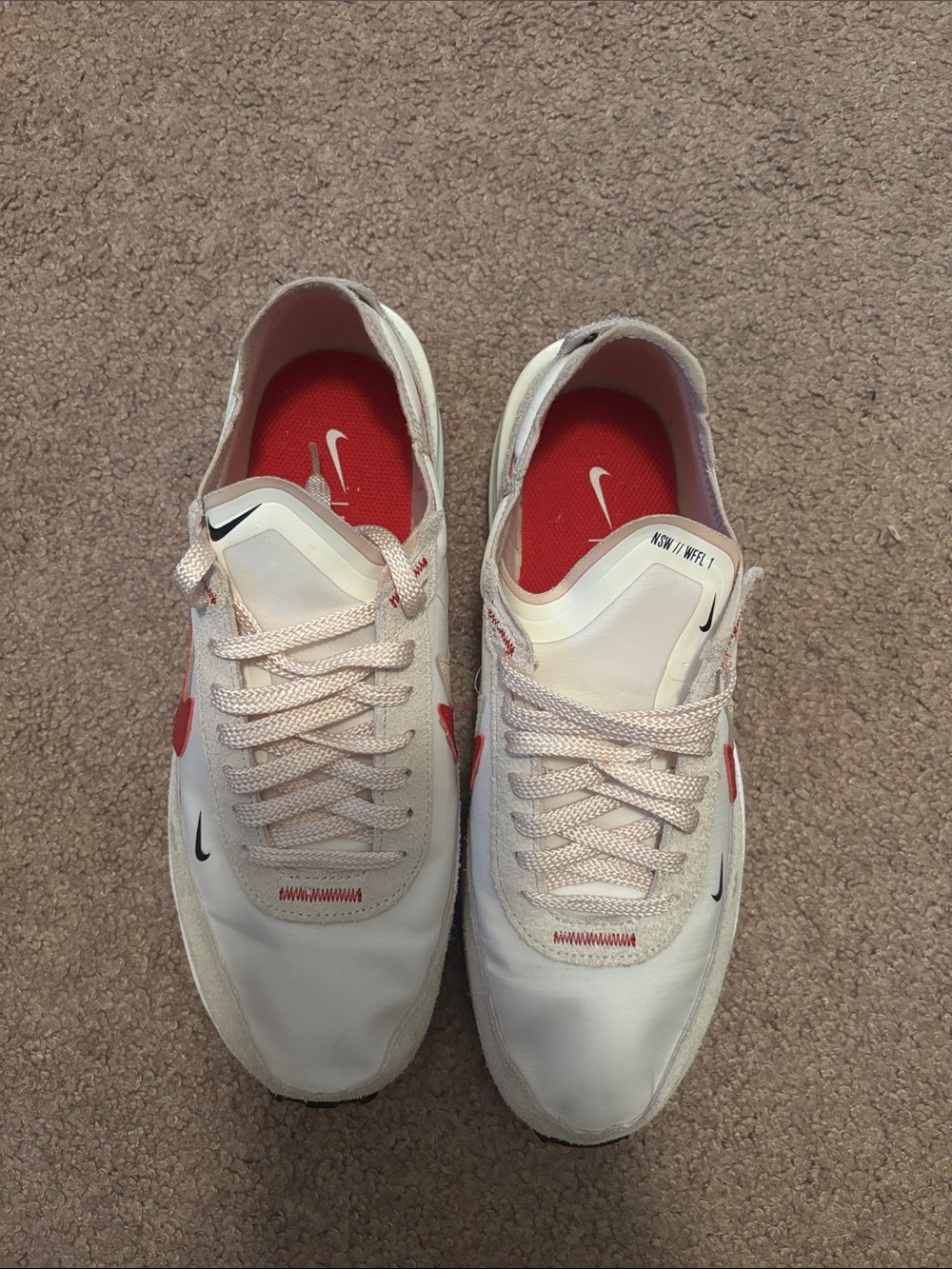 Nike White Sneakers with Red Insoles and Black Swooshes